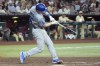 Los Angeles Dodgers' Will Smith connects for a three-run home run against the Arizona Diamondbacks during the seventh inning of a baseball game Friday, Aug. 30, 2024, in Phoenix. (AP Photo/Ross D. Franklin)