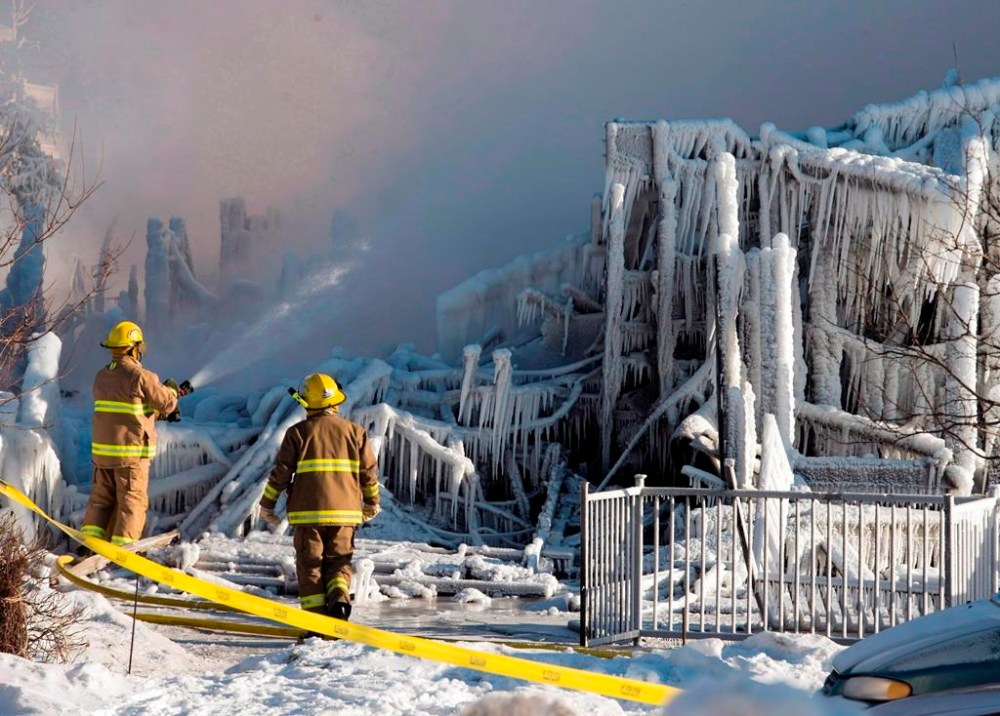 Quebec mandated sprinklers be installed in all seniors homes with 10 units or more after a fire killed 32 residents of a seniors home in 2014, leaving a looming legacy for future small-scale seniors residences, hundreds of which have closed since 2020. Firefighters continue to douse the rubble where a fatal fire destroyed a seniors residence in L'Isle-Verte, Que., Thursday, Jan. 23, 2014. THE CANADIAN PRESS/Ryan Remiorz