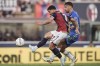 Bologna's Riccardo Orsolini fights for the ball with Empoli's Mattia Viti, right, during the Serie A soccer match between Bologna and Empoli at Renato Dall'Ara Stadium, Bologna, Italy, Saturday Aug. 31, 2024. (Massimo Paolone/LaPresse via AP)