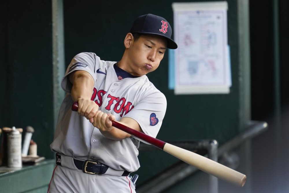 Boston Red Sox's Masataka Yoshida swings a bat in the dugout in the fifth inning of a baseball game against the Detroit Tigers, Saturday, Aug. 31, 2024, in Detroit. (AP Photo/Paul Sancya)