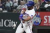 Texas Rangers' Leody Taveras hits a bases loaded single scoring teammate Ezequiel Duran ending the ninth inning to win a baseball game against the Oakland Athletics, Saturday, Aug. 31, 2024, in Arlington, Texas. (AP Photo/LM Otero)
