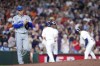 Kansas City Royals starting pitcher Cole Ragans, left, walks back to the mound after Houston Astros' Jeremy Pena, back right, hit a 2-run triple during the sixth inning of a baseball game Saturday, Aug. 31, 2024, in Houston. (AP Photo/Eric Christian Smith)