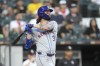 New York Mets' Jesse Winker watches his RBI sacrifice fly during the third inning of a baseball game against the Chicago White Sox on Saturday, Aug. 31, 2024, in Chicago. (AP Photo/Charles Rex Arbogast)