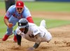 St. Louis Cardinals third baseman Nolan Arenado, top, tags out New York Yankees' Gleyber Torres, bottom, after a rundown during the eighth inning of a baseball game, Saturday, Aug. 31, 2024, in New York. (AP Photo/Noah K. Murray)