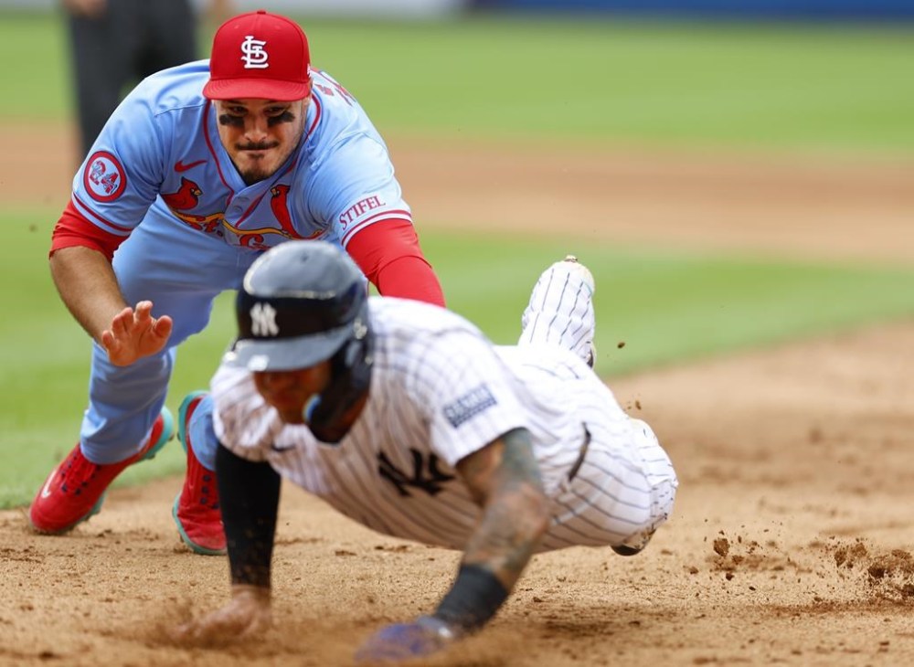 St. Louis Cardinals third baseman Nolan Arenado, top, tags out New York Yankees' Gleyber Torres, bottom, after a rundown during the eighth inning of a baseball game, Saturday, Aug. 31, 2024, in New York. (AP Photo/Noah K. Murray)