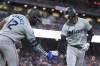 Miami Marlins' Connor Norby, right, celebrates with Jesús Sánchez after hitting a solo home run during the sixth inning of a baseball game against the San Francisco Giants, Saturday, Aug. 31, 2024, in San Francisco. (AP Photo/Godofredo A. Vásquez)