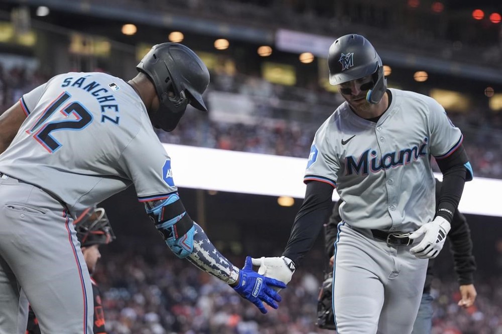 Miami Marlins' Connor Norby, right, celebrates with Jesús Sánchez after hitting a solo home run during the sixth inning of a baseball game against the San Francisco Giants, Saturday, Aug. 31, 2024, in San Francisco. (AP Photo/Godofredo A. Vásquez)