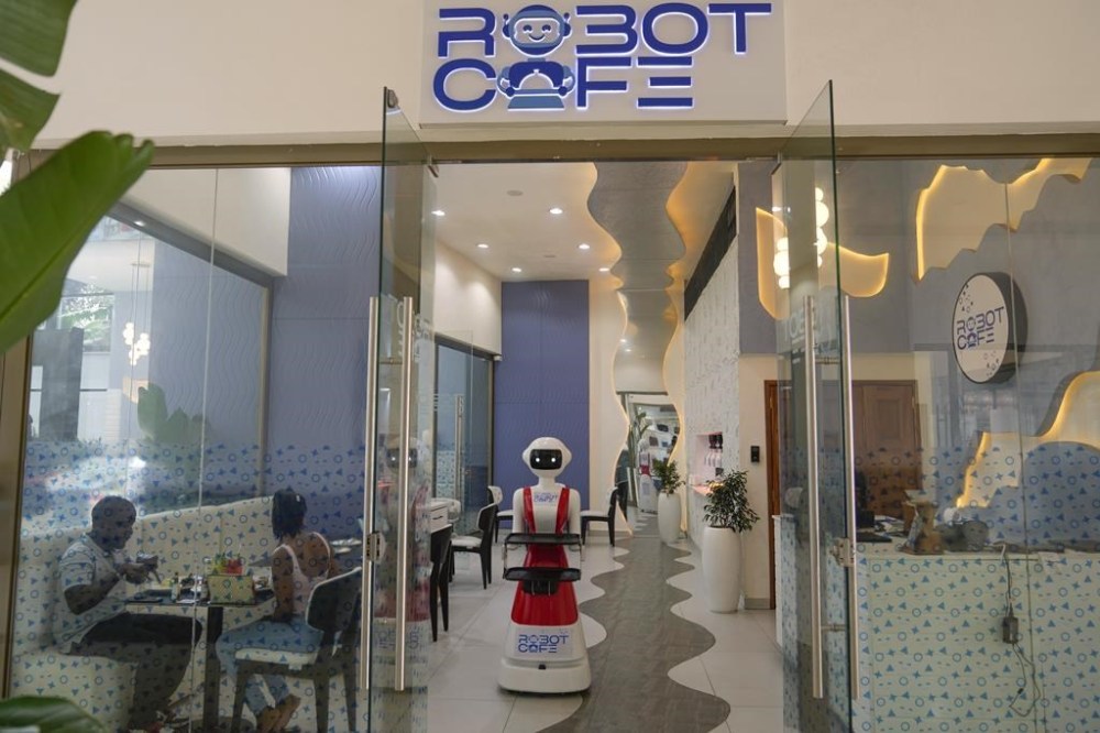 Robotic waiter serves customers at a Robot Cafe in Nairobi, Kenya Thursday, Aug. 29, 2024. The three robots, christened Claire, R24 and Nadia, are not programmed to have a full conversation with customers, but they can say