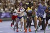 Liza Corso from the U.S., foreground left, works her way through the pack and on to a bronze medal during the 1500 meter T13 race at the Paralympic Games in Paris, Saturday, Aug. 31, 2024. (AP Photo/Avni Trivedi)