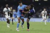 Napoli's David Neres Campos, and Parma's goalkeeper Zion Suzuki in action during the Italian Serie A soccer match between Napoli and Parma at the Diego Armando Maradona Stadium in Naples, southern Italy, Saturday, Aug. 31, 2024. (Alessandro Garofalo/LaPresse via AP)