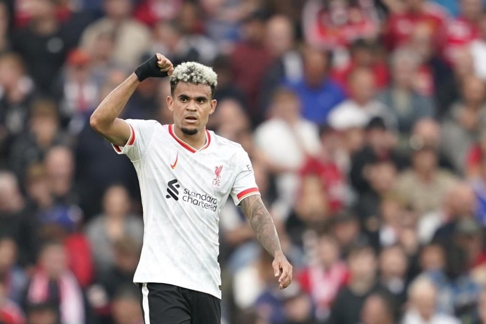 Liverpool's Luis Diaz celebrates after scoring during the English Premier League soccer match between Manchester United and Liverpool at Old Trafford, Sunday, Sept. 1, 2024, in Manchester, England. (AP Photo/Dave Thompson)