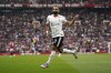 Liverpool's Mohamed Salah celebrates after scoring his side's third goal during the English Premier League soccer match between Manchester United and Liverpool at Old Trafford, Sunday, Sept. 1, 2024, in Manchester, England. (AP Photo/Dave Thompson)