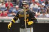 Pittsburgh Pirates' Rowdy Tellez walks back to the dugout after striking out against Cleveland Guardians starting pitcher Alex Cobb during the fifth inning of a baseball game in Cleveland, Sunday, Sept. 1, 2024. (AP Photo/Phil Long)