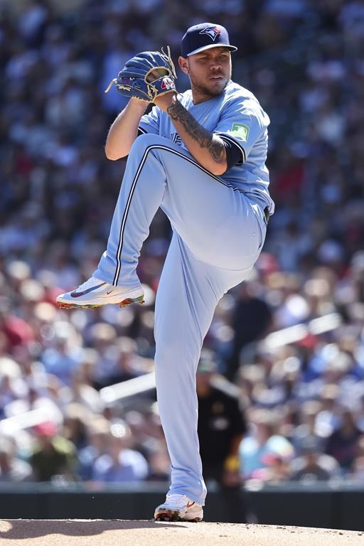 Toronto Blue Jays starting pitcher Yariel Rodríguez winds up to deliver against the Minnesota Twins during the first inning of a baseball game, Sunday, Sept. 1, 2024, in Minneapolis. (AP Photo/Matt Krohn)