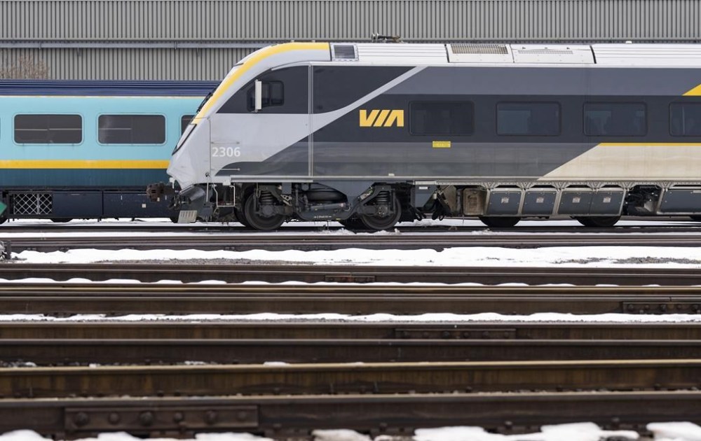 Passenger trains sit on the tracks at the Via Rail Canada Maintenance Centre in Montreal, Feb. 22, 2024. Via Rail apologizes after passengers stranded Canada's transport minister says he is determined to get to the bottom of a recent train delay that left passengers stranded for about 10 hours.THE CANADIAN PRESS/Christinne Muschi