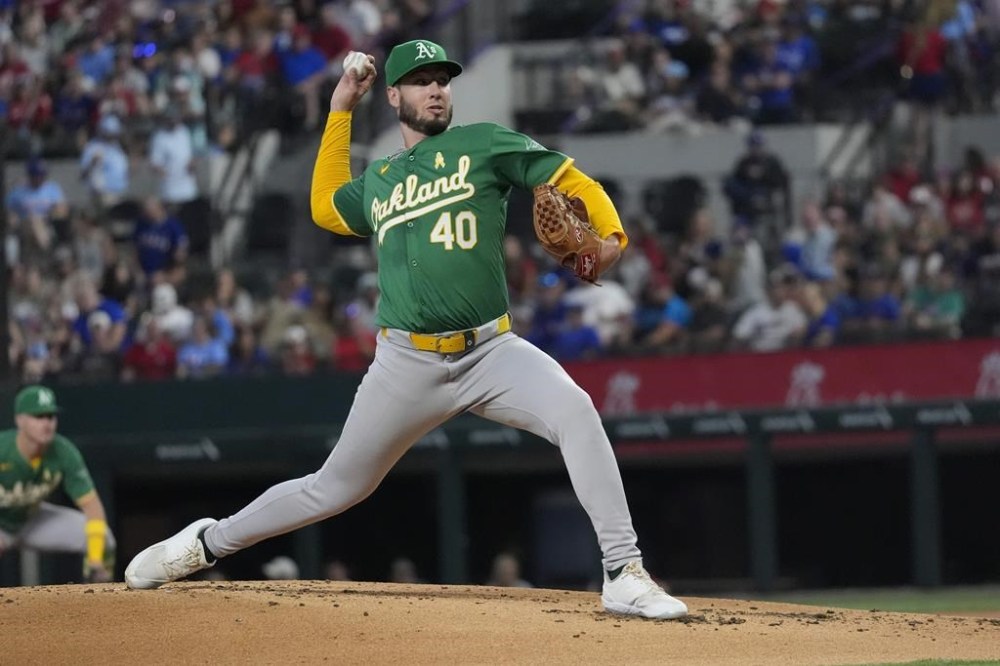 Oakland Athletics starting pitcher Mitch Spence throws during the first inning of a baseball game against the Texas Rangers, Sunday, Sept. 1, 2024, in Arlington, Texas. (AP Photo/LM Otero)