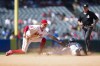 Seattle Mariners' Josh Rojas (4) steals second base ahead of a tag by Los Angeles Angels shortstop Zach Neto, left, during the seventh inning of a baseball game in Anaheim, Calif., Sunday, Sept. 1, 2024. (AP Photo/Ashley Landis)