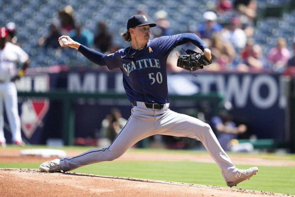 Seattle Mariners starting pitcher Bryce Miller (50) throws during the first inning of a baseball game against the Los Angeles Angels in Anaheim, Calif., Sunday, Sept. 1, 2024. (AP Photo/Ashley Landis)