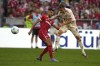 Freiburg's Vincenzo Grifo, left, and Bayern's Joshua Kimmich fight for the ball during the Bundesliga soccer match between Bayern Munich and SC Freiburg at the Allianz Arena in Munich, Germany, Sunday, Sept. 1, 2024. (AP Photo/Matthias Schrader)