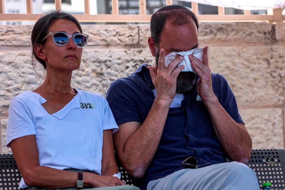 Jonathan Polin and Rachel Goldberg, parents of Israeli-American hostage Hersh Goldberg-Polin, who was killed in Hamas captivity in the Gaza Strip, attend their son's funeral in Jerusalem, Monday, Sept. 2, 2024. (Gil Cohen-Magen/Pool via AP)
