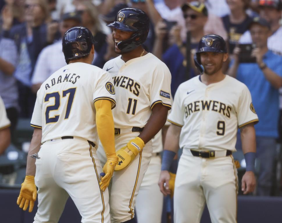 Milwaukee Brewers Willy Adames (27) reacts with Jackson Chourio(11) after his three-run home run during the first inning of a baseball game against the St. Louis Cardinals Monday, Sept. 2, 2024, in Milwaukee. (AP Photo/Jeffrey Phelps)