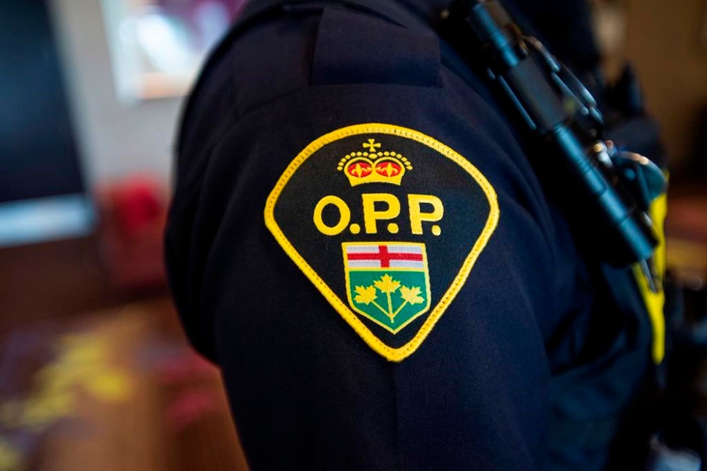 A 39-year-old man is dead after a fire broke out in his Midland, Ont., home over the weekend. An Ontario Provincial Police crest is displayed on the arm of an officer during a press conference in Vaughan, Ont., on Thursday, June 20, 2019. THE CANADIAN PRESS/Andrew Lahodynskyj
