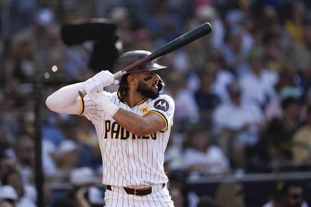 San Diego Padres' Fernando Tatis Jr. takes a practice swing before batting during the third inning of a baseball game against the Detroit Tigers Monday, Sept. 2, 2024, in San Diego. (AP Photo/Gregory Bull)