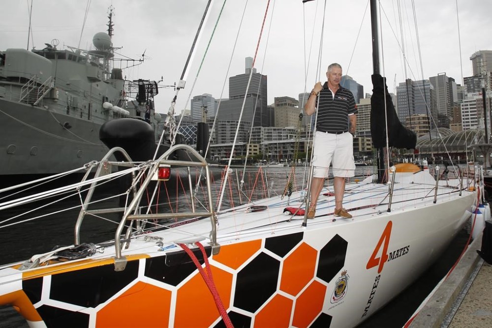 Sailor Craig McCarthy stands on the deck of the yacht