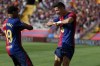 Barcelona's Robert Lewandowski, right, celebrates scoring his side's 2nd goal with Lamine Yamal during the Spanish La Liga soccer match between FC Barcelona and Valladolid at the Olympic stadium in Barcelona, Spain, Saturday, Aug. 31, 2024. (AP Photo/Joan Monfort)
