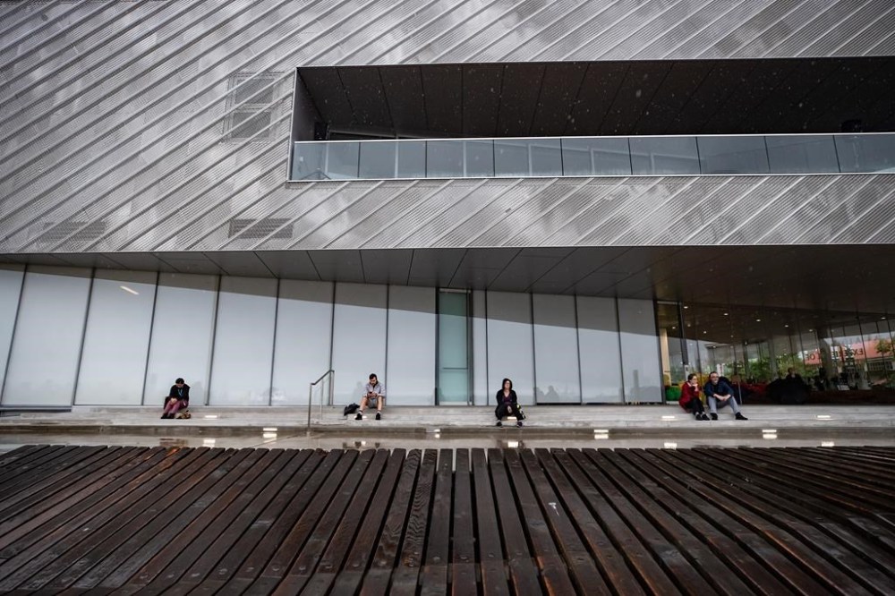 People sit outside and listen as string players perform a concert to mark the 75th anniversary of the Hiroshima bombing, at the Polygon Gallery, in North Vancouver, B.C., on Thursday, August 6, 2020.THE CANADIAN PRESS/Darryl Dyck