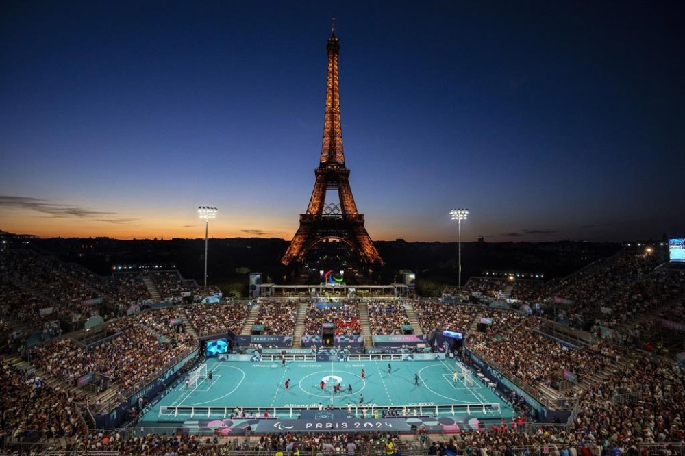 Blind soccer players from France and China compete in a Preliminary Round Group A - Match 4, at the Eiffel Tower Stadium, during the 2024 Paralympics, Sunday, Sept. 1, 2024, in Paris, France. (AP Photo/Emilio Morenatti)