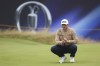 Mackenzie Hughes, of Canada, lines up a putt on the 13th green during his opening round of the British Open Golf Championships at Royal Troon golf club in Troon, Scotland, Thursday, July 18, 2024. Canadians Taylor Pendrith, Corey Conners and Hughes have been named to the International Team's for the upcoming Presidents Cup in Montreal. THE CANADIAN PRESS/AP-Peter Morrison