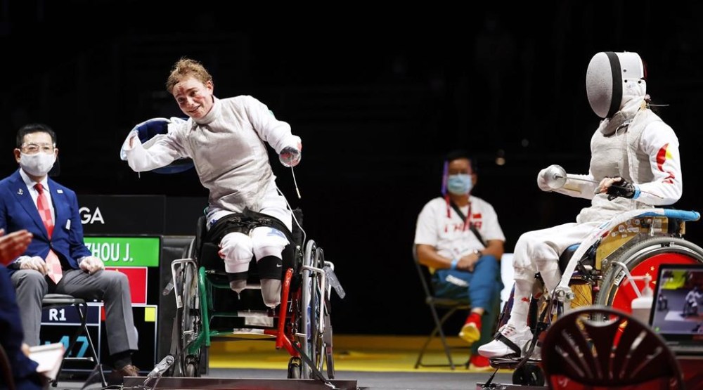FILE - In this Saturday, Aug. 28, 2021 file photo, Italy's Beatrice Maria Vio, left, celebrates after winning over China's Zhou Jingjing during their the wheelchair fencing women's foil Individual category B gold medal match in Chiba, at the Tokyo 2020 Paralympic Games. (Kyodo News via AP, File)