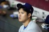 Los Angeles Dodgers' Shohei Ohtani, of Japan, sits in the dugout during the seventh inning of a baseball game against the Arizona Diamondbacks, Sunday, Sept. 1, 2024, in Phoenix. (AP Photo/Ross D. Franklin)
