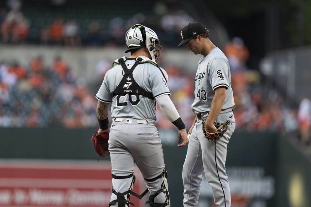 Chicago White Sox starting pitcher Nick Nastrini (43) reacts during a mount visit with catcher Korey Lee during the first inning of a baseball game against the Baltimore Orioles, Tuesday, Sept. 3, 2024, in Baltimore. (AP Photo/Stephanie Scarbrough)