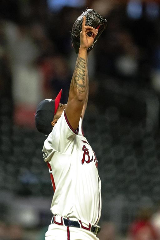 Atlanta Braves pitcher Raisel Iglesias celebrates the win in the ninth inning of a baseball game against the Colorado Rockie, Tuesday, Sep. 3, 2024, in Atlanta. (AP Photo/Jason Allen)