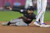 Cleveland Guardians' Andres Gimenez looks for the call after being caught stealing second during the fifth inning of a baseball game against the Kansas City Royals Tuesday, Sept. 3, 2024, in Kansas City, Mo. (AP Photo/Charlie Riedel)
