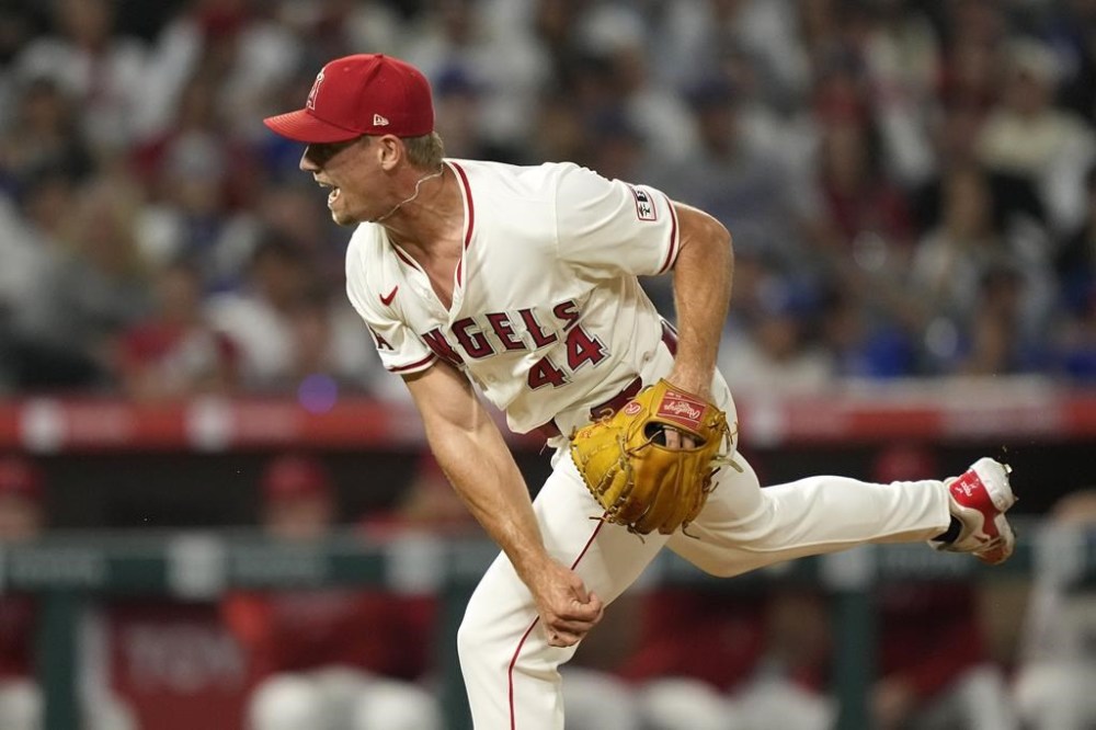Los Angeles Angels relief pitcher Ben Joyce throws a 105.5 mph pitch as he strikes out Los Angeles Dodgers' Tommy Edman to end the ninth inning of a baseball game, Tuesday, Sept. 3, 2024, in Anaheim, Calif. (AP Photo/Mark J. Terrill)