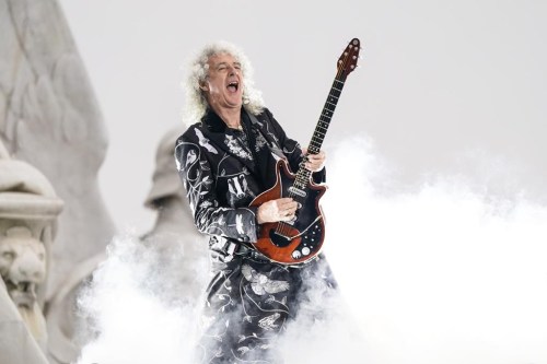 FILE - Brian May performs at the Platinum Jubilee concert taking place in front of Buckingham Palace, London, on June 4, 2022. Brian May, the lead guitarist of legendary British rock band Queen, revealed Wednesday that he had a “minor stroke” last week, which caused him to temporarily lose control over his arm. (AP Photo/Alberto Pezzali, Pool File)