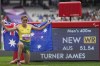 Australia's James Turner celebrates after winning the men's 400 m. T36 and setting a new world record during the 2024 Paralympics, Tuesday, Sept. 3, 2024, in Paris, France. (AP Photo/Thibault Camus)