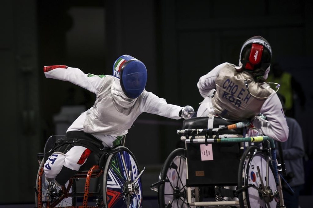Italy's Beatrice Maria Vio Grandis, left, and South Korea's Cho Sun Eye compete in the women's foil wheelchair fencing bronze medal match at the 2024 Paralympics, Wednesday, Sept. 4, 2024, in Paris, France. (AP Photo/Thomas Padilla)