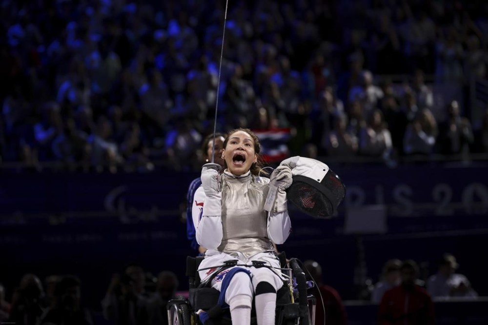 Thailand's Saysunee Jana reacts after winning gold medal against China's Rong Xiao during the women's foil wheelchair fencing Category B Gold Medal at the 2024 Paralympics, Wednesday, Sept. 4, 2024, in Paris, France. (AP Photo/Thomas Padilla)