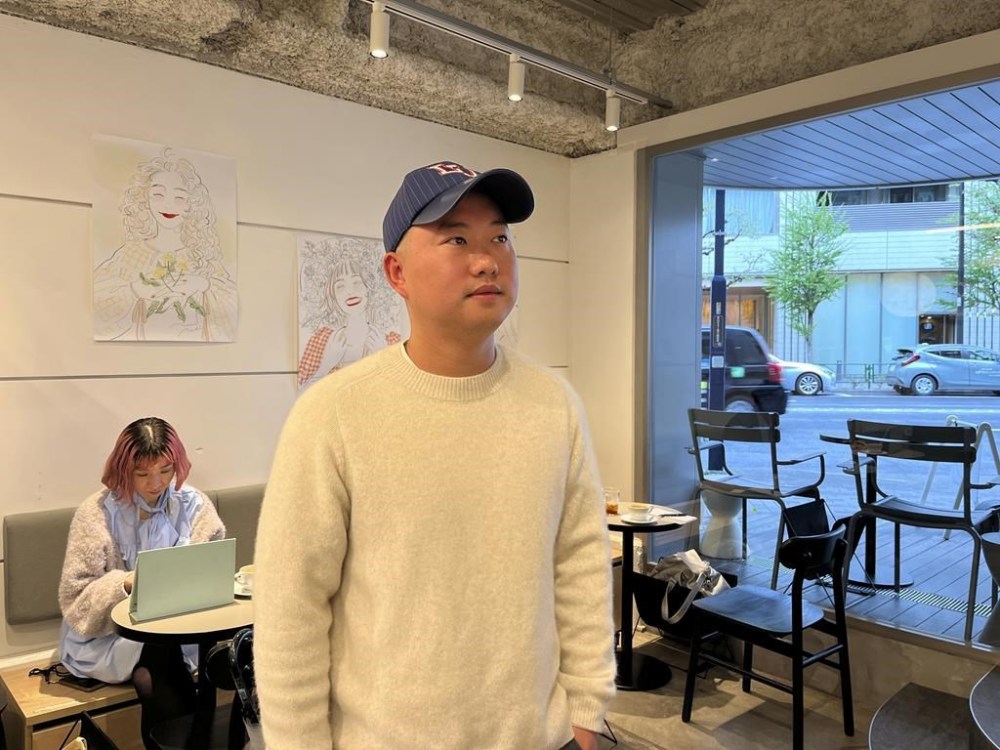 Guo Yu, an engineer who retired early after working at ByteDance, the parent company of hit video-sharing app TikTok, and who lives in Japan, speaks during an interview with The Associated Press in Tokyo, April 9, 2024. (AP Photo/Yuri Kageyama)