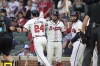 Atlanta Braves' Jarred Kelenic (24) high fives teammates after hitting a three run home run in the first inning of a baseball game against the Colorado Rockies, Wednesday, Sept. 4, 2024, in Atlanta. (AP Photo/Brynn Anderson)