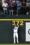 Texas Rangers left fielder Wyatt Langford makes the catch on a long fly out by New York Yankees' Anthony Volpe during the second inning of a baseball game Wednesday, Sept. 4, 2024, in Arlington, Texas. (AP Photo/Jeffrey McWhorter)