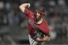 Arizona Diamondbacks pitcher Zac Gallen works against the San Francisco Giants during the third inning of a baseball game in San Francisco, Wednesday, Sept. 4, 2024. (AP Photo/Jeff Chiu)
