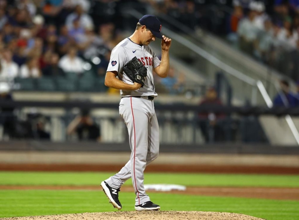 Boston Red Sox pitcher Rich Hill (44) reacts after walking in a run during the eighth inning of a baseball game against the New York Mets, Wednesday, Sept. 4, 2024, in New York. (AP Photo/Noah K. Murray)