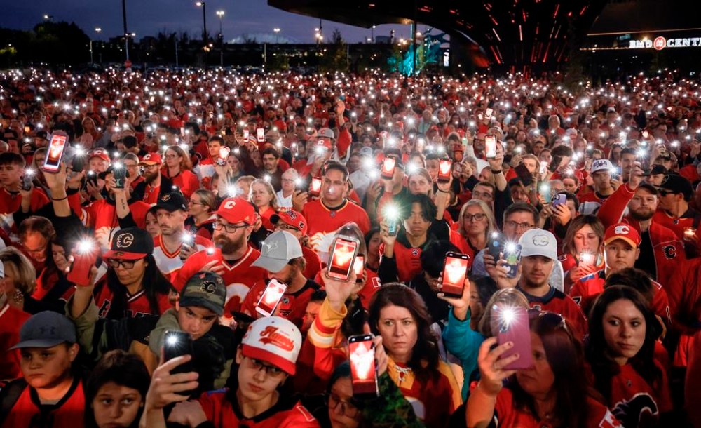 Fans attend a vigil for former Calgary Flames player Johnny Gaudreau and his brother Matthew in Calgary, Alta., Wednesday, Sept. 4, 2024. The brothers were struck and killed by a suspected drunk driver last week while cycling near their childhood home in New Jersey. THE CANADIAN PRESS/Jeff McIntosh