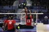 Iran's Morteza Mehrzadselakjani, number 2, attempts to block the ball from Egypt's Zakareia Abdo during the semifinal of the men's sitting volleyball at the North Paris Arena at the 2024 Paralympics in Pars, Thursday, Sept. 5, 2024. (AP Photo/Kileigh Kane)