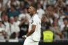 Real Madrid's Kylian Mbappe celebrates after scoring his sides second goal during the Spanish La Liga soccer match between Real Madrid and Betis at the Santiago Bernabeu stadium in Madrid, Spain, Sunday, Sept. 1, 2024. (AP Photo/Pablo Garcia)